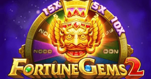 Fortune Gems 2 slot game logo with golden wild mask and colorful spinning reward wheel showing multipliers like 15x, 10x, and 5x