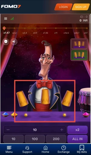 Mr. Thimble game in Easy Mode showing two yellow balls placed under cups before shuffle on the FOMO7 app interface.