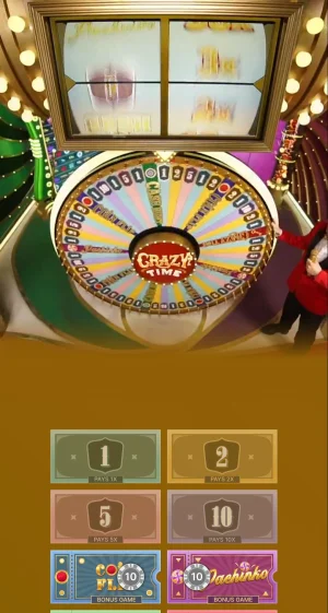 Crazy Time live wheel spinning with the Top Slot reels rolling above to assign a random multiplier before the main wheel lands.